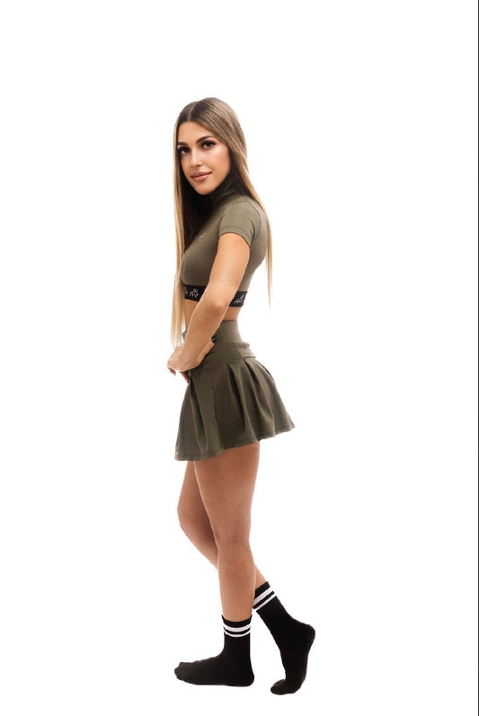 Minimalist olive mini skirt with built-in hidden shorts for comfort and coverage, designed for modern luxury and active urban living.