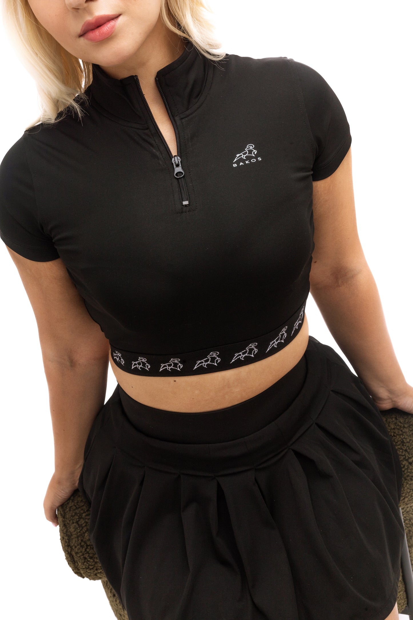 Black short sleeve top with a tailored fit, from a modern luxury fashion brand blending sporty and minimalistic style.