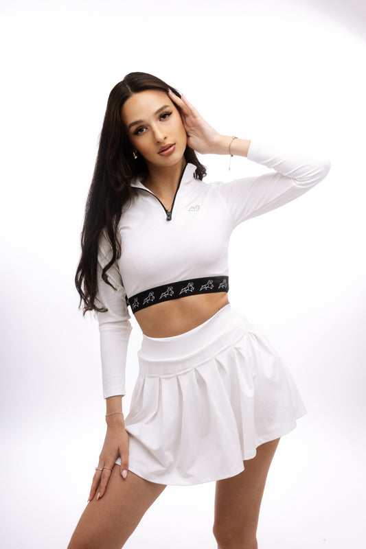 Minimalist white mini skirt with built-in hidden shorts for comfort and coverage, designed for modern luxury and active urban living.