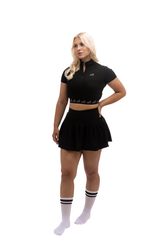 Minimalist black mini skirt with built-in hidden shorts for comfort and coverage, designed for modern luxury and active urban living.